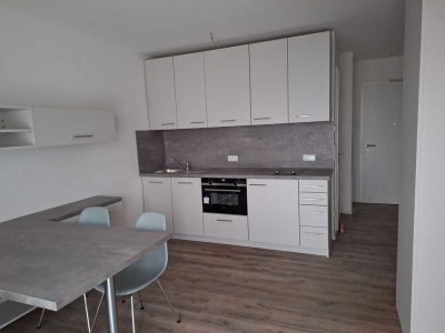 Möbliertes Neubau City Appartement mit Garten nahe BMW/ TG- Einzelstellplatz mit E- Ladefunktion