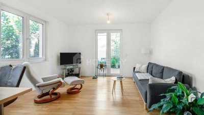 Exklusive und moderne Erdgeschosswohnung mit 2 Zimmern, zwei Terrassen und 2 Tiefgaragenplätzen