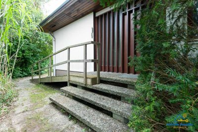 Naturidylle auf zwei Ebenen: Geräumiger Bungalow mit großem Garten und Garage