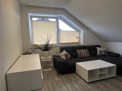 Moderne, helle Dachgeschosswohnung mit Wintergarten in Holsen