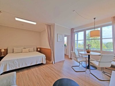 Ihr Rückzugsort im Grünen: Modernes 1,5-Zimmer-Apartment mit Blick auf den Kurpark und Wellness vor