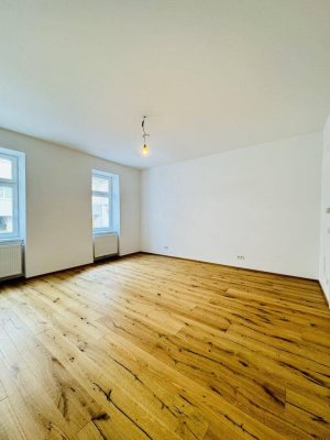 Charmante Erstbezugs-1-Zimmer-Wohnung in einem generalsanierten Altbauhaus mit einem eigenen Gartenabteil zur exklusiven Nutzung.