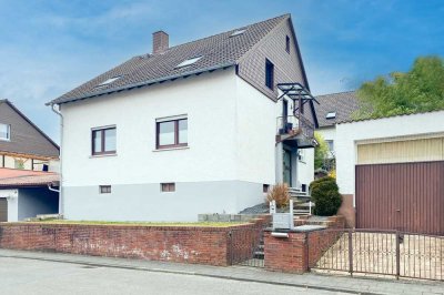 Wohnen und Vermieten – Zweifamilienhaus mit großem Garten in Reinheim!