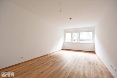 Moderne Erstbezug-Wohnung mit Fußbodenheizung und Tiefgarage in zentraler Lage - perfekt für Singles!