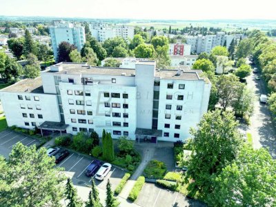 3,5-Zimmer-Erdgeschosswohnung mit Südwest-Loggia und Tiefgaragenstellplatz in idyllisch gelegenem, b