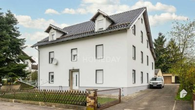 Top gepflegtes Mehrfamilienhaus mit 4 WE's, 10 Garagen, Nebengelass und großem Grundstück.