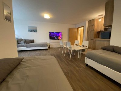 gemütliche 1,5-Zimmer-Apartment mit Terrasse und Stellplatz - möbliert.