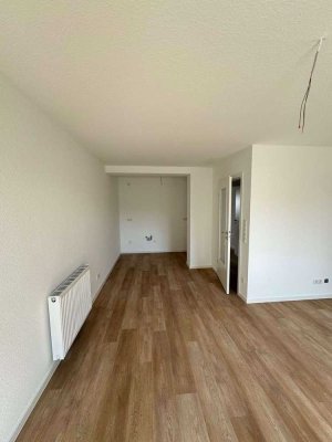 Sanierte 3 Zimmer Wohnung mit großer Nutzfläche im Keller und kleinem Garten