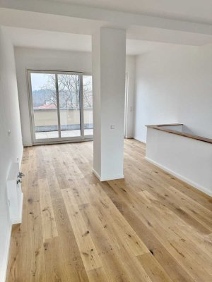 Erstbezug: Helle Maisonette-Wohnung mit Südterrasse, direktem Seezugang und großzügiger Parkanlage