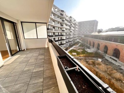 EXKLUSIVER ERSTBEZUG nahe Hauptbahnhof - Sonnige Wohnung mit großzügiger Freifläche und Küche in einem modernen Neubauprojekt