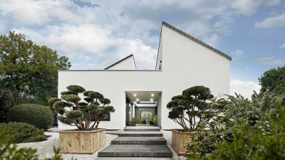 UNSER AUS­GE­ZEICH­NE­TES MUSTERHAUS MIT INSPIRIERENDER ARCHITEKTUR