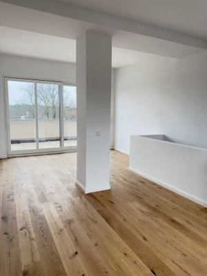 Erstbezug: Helle Maisonette-Wohnung mit Südterrasse, direktem Seezugang und großzügiger Parkanlage