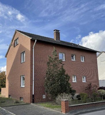 Erdgeschosswohnung mit Garten und Garagen in Wiedenbrück