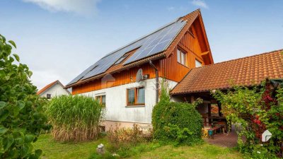 Wohnen wie in einem Eigenheim, 3-Zimmer-Wohnung mit ELW im Souterrain, Garten, Garage und Carport