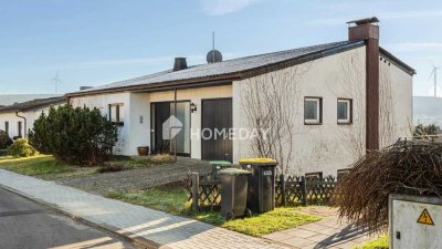 Wohnen mit Weitblick: Frei stehendes Einfamilienhaus mit überdachter Terrasse