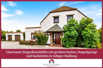 Charmante Doppelhaushälfte mit großem Garten, Doppelgarage und Kachelofen in ruhiger Siedlung