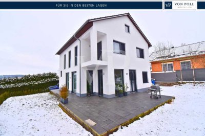 Moderne Architektur trifft ländliche Idylle: Ihr neues Zuhause im Grünen