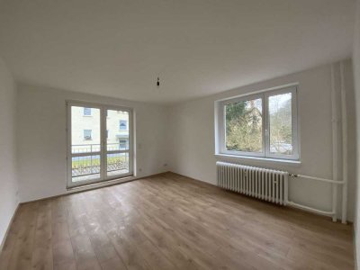 Schön geschnittene Wohnung mit EBK und Garten