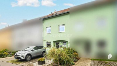 Familienidylle pur: Reihenmittelhaus mit sonnigem Balkon, Terrasse, Tiefgarage und 2 Stellplätzen