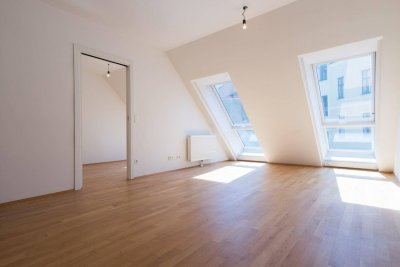 ab 1.3. Helle 2-Zimmer-Wohnung mit gemeinschaftlicher Dachterrasse! Garage inkl.!