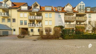 Attraktive Terrassenwohnung mit 3 Zimmern, Gartenanteil, TG-Stellplatz und EBK in ruhiger Lage