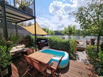 Direkt am Rhein: Besondere Wohnung für Singles oder Paare mit großer Terrasse mit Rheinblick