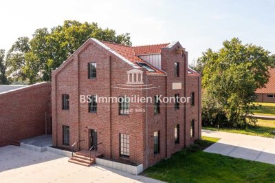 Erstbezug! Wohnung im EG mit Einbauküche, Terrasse und Stellplätzen in zentraler Lage!