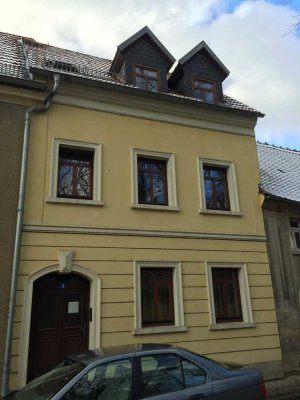 Single-Wohnung im Erdgeschoß mit Einbauküche und Terrasse