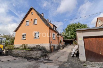 Familienfreundliches Einfamilienhaus mit Einliegerwohnung und Garten in Rauhenebrach