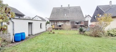 Vielseitiges Zweifamilienhaus: Großzügig mit Garten, ideal für Großfamilie oder Mehrgenerationen