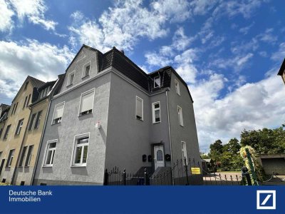 Charmante Dachgeschosswohnung mit Balkon, Garten und Garage