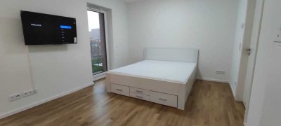 Möblierte 35 qm Neubauwohnung mit Süd-Terrasse und Garten