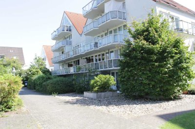 Hausmarke Immobilien - Vermietete Zweiraumwohnung mit zwei Tiefgargenstellplätzen in Rheinnähe