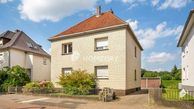 Charmantes Ein- bis Zweifamilienhaus, Garten, Terrasse und Garagen in zentraler Lage