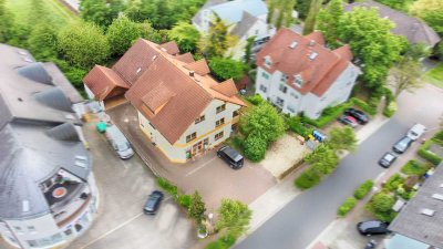 Vermietetes Wohn-/Geschäftshaus plus großzügiges EFH mit Garten in Feldrandlage von Bruchköbel