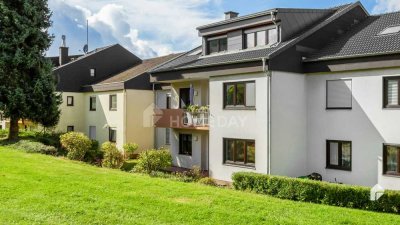 Charmante Erdgeschosswohnung mit großer Terrasse und Zugang zum grünen Außenbereich in ruhiger Lage