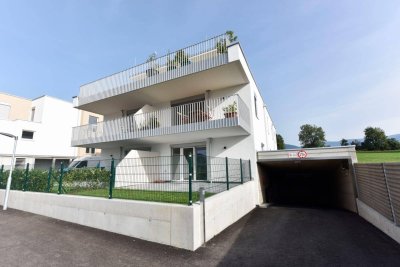 Erdgeschosswohnung mit Einbauküche, separaten Schlafzimmer und Tiefgaragenplatz zu vermieten