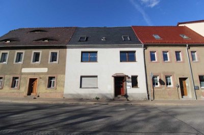 Gepflegtes Reihenmittelhaus mit Garten bereit zur Modernisierung