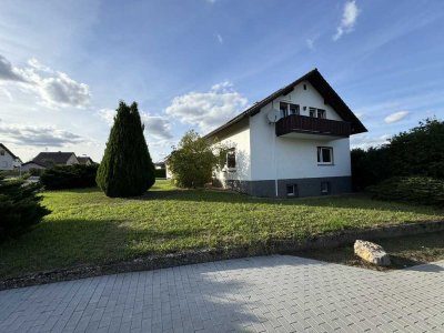 Einfamilienhaus mit Garage und Garten in ruhiger Aussichtslage zum Verkauf