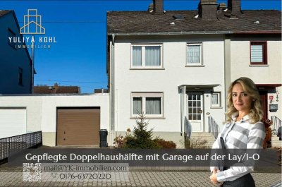 Gepflegte Doppelhaushälfte mit Garage, Garten und ausgebautem Dachgeschoss in ruhiger Lage