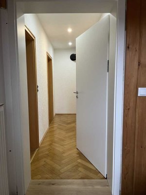 Zwei Zimmer EG-Wohnung mit Terrasse und Garten