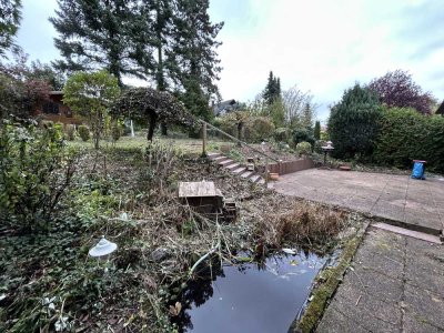 Traumhafte Lage - Gartenidylle - Einfamilienhaus mit Charme und Potenzial