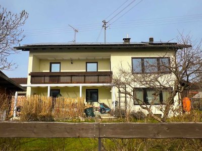 3 - 4 Zi. Landhauswohnung mit Südbalkon, Garage, Stellplatz und Gartenanteil in sonniger Ortslage.