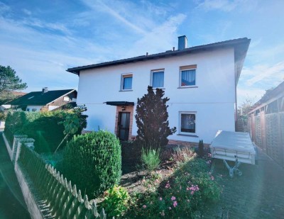 Hübsches Einfamilienhaus mit Wintergarten, Einliegerbereich und unverbaubarem Blick in die Natur